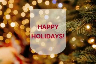 picture with lights, christmas tree and message happy holidays